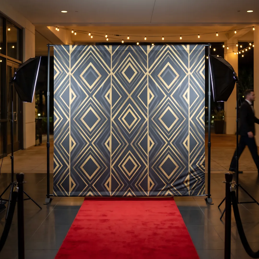 Step and repeat backdrop banner at a branded event