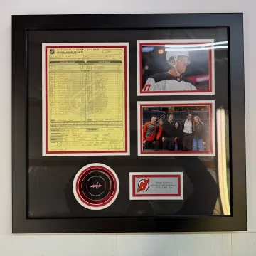 Craftsperson assembling a custom framed award