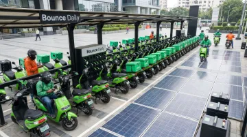 Bounce Daily EV scooter hub with fleet of electric scooters ready for delivery partners