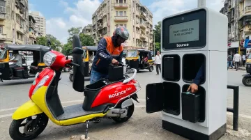 Bounce Daily electric scooter swappable battery swap station in urban setting