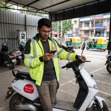 Rider checking delivery tasks on a phone