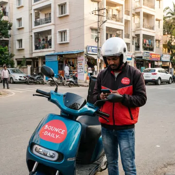 Rider reviewing delivery opportunities on a phone