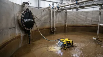 Bristola robotic ROV system cleaning food processing liquid storage tank without production shutdown