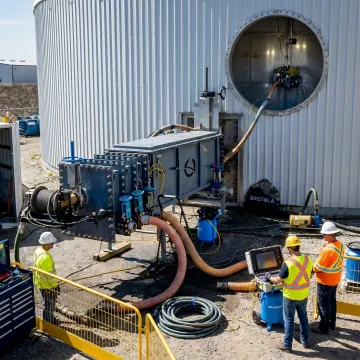 Robotic system cleaning an industrial storage tank