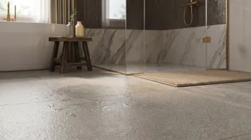 Slip-resistant textured porcelain bathroom floor tile in wet environment