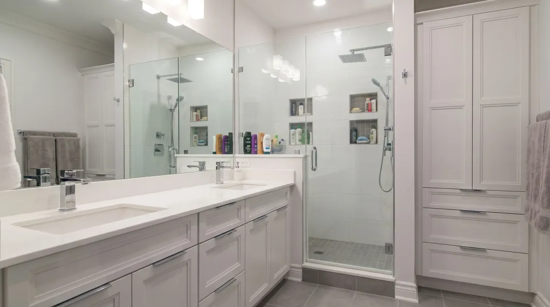Bergen County double vanity bathroom remodel showing reconfigured layout and built-in storage