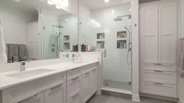 Bergen County double vanity bathroom remodel showing reconfigured layout and built-in storage