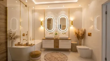 Layered bathroom lighting with vanity sconces and recessed ceiling LED fixtures