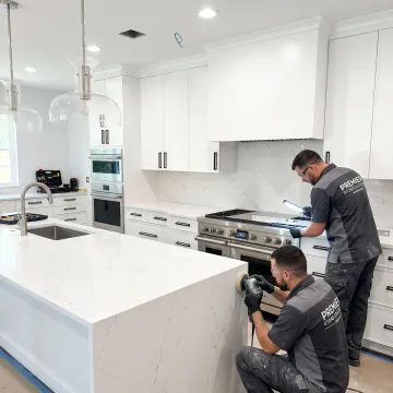 Installed quartz countertop in a modern kitchen