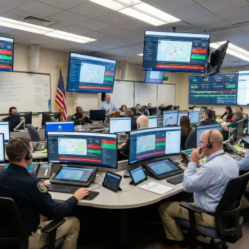 Emergency operations center team managing critical incident using BCG operational resilience software