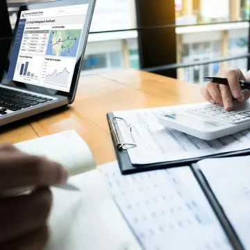 Freight manager reviewing LTL shipping data and carrier options