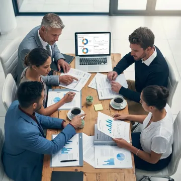 Consultants reviewing healthcare spend analysis process