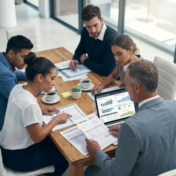 Business consultant reviewing cash flow analytics