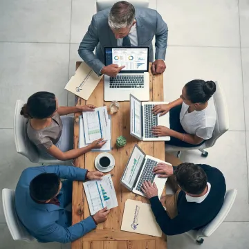 Corporate treasury advisor reviewing financial analytics