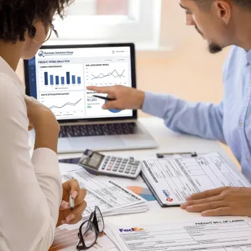 Consultant reviewing invoices and recovery data