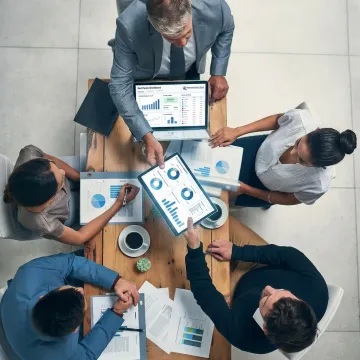 IT and finance leaders reviewing SaaS spend dashboards
