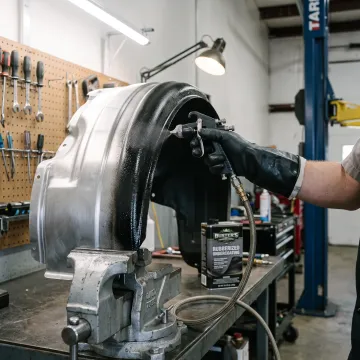 Rust protection coating being applied to metal components