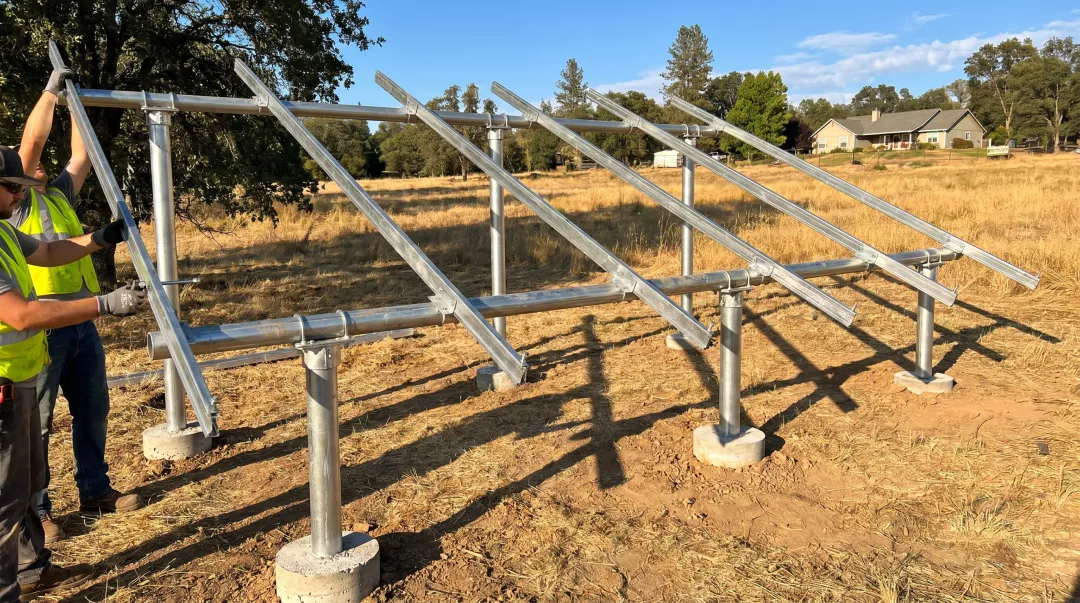 Ground-mount solar racking structure assembly with steel rails and tilt angle set