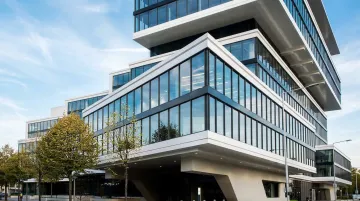 Kawneer thermally broken aluminum curtain wall system installed on modern commercial building facade