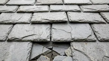 Natural slate roof tiles with visible brittleness and cracking challenges for solar mounting