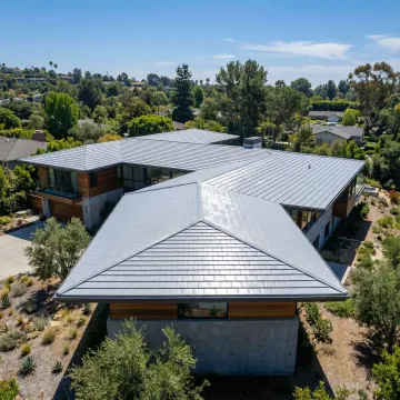 Energy-efficient roof remodeling showcasing cool roof technology and modern materials