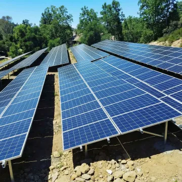 Ground mount solar array with optimal sun exposure and natural cooling