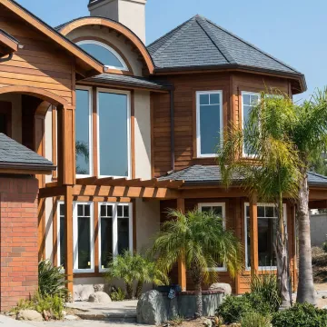 Modern home with newly remodeled roof featuring energy-efficient materials