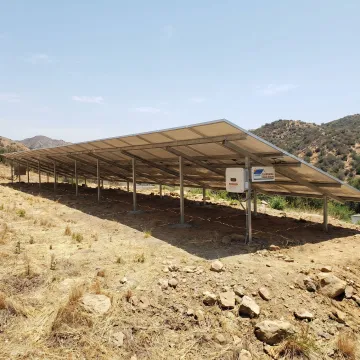 Ground-mounted solar panels installed on open property
