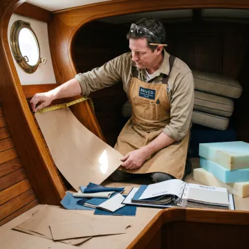 Craftsperson measuring a yacht berth