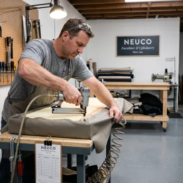 Upholsterer finishing a restaurant booth