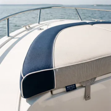 Custom upholstered bow sun pad on a boat