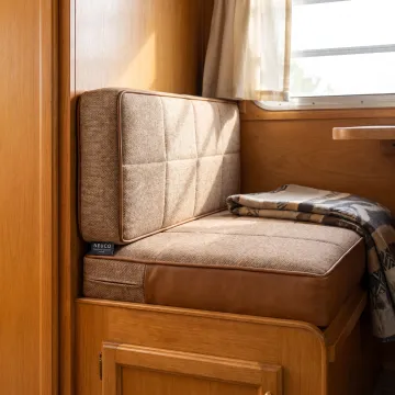 Custom upholstered cushions on a vintage RV dinette