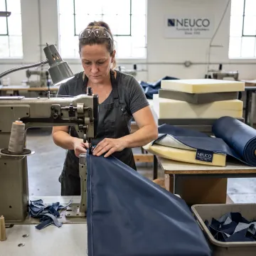 Commercial sewing specialist working on custom upholstery