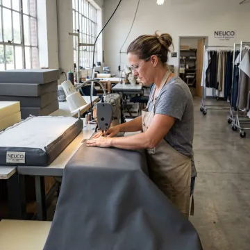 Sewing specialist creating a commercial cushion