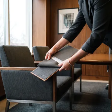 Designer selecting upholstery fabric for law office seating