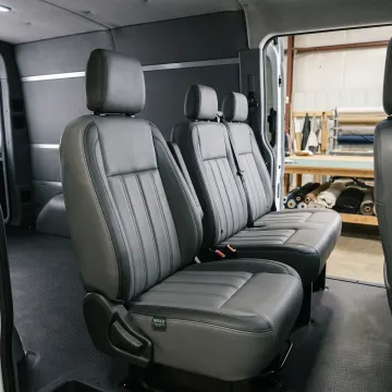 Commercial vehicle interior with custom upholstered seating