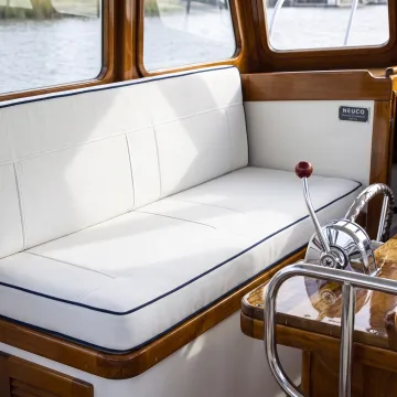 Custom upholstered seating inside a boat cabin