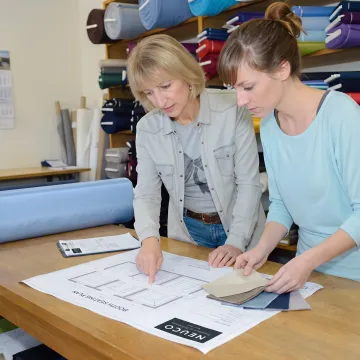 Designer reviewing restaurant booth fabric samples