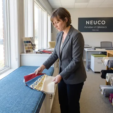 Designer reviewing fabric for a window seat cushion