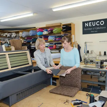 Designer reviewing upholstery fabrics for commercial seating