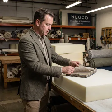 Designer selecting fabric for custom foam cushions