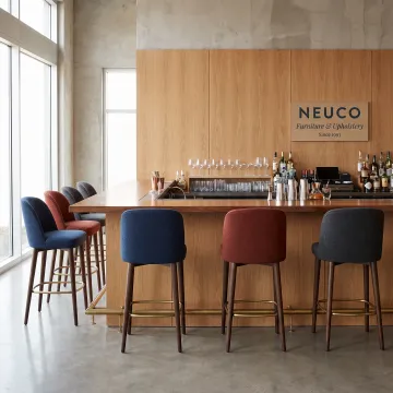 Upholstered custom bar stools in a commercial interior