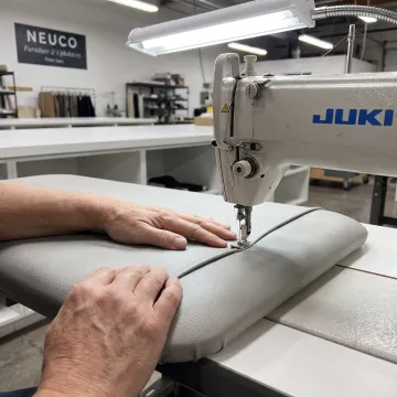 Technician sewing a custom medical cushion