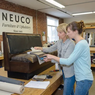 Designer reviewing upholstery fabrics for commercial seating