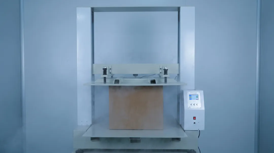 Corrugated cardboard box compression strength testing in industrial laboratory setting