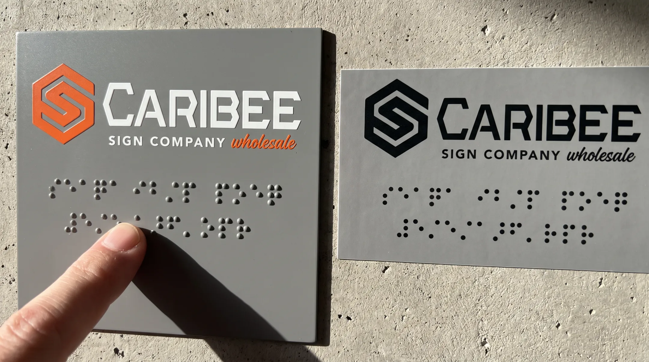 Close-up comparison of raised braille dots versus flat printed braille sticker