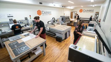 Caribee Sign production facility with CNC routing and laser engraving equipment