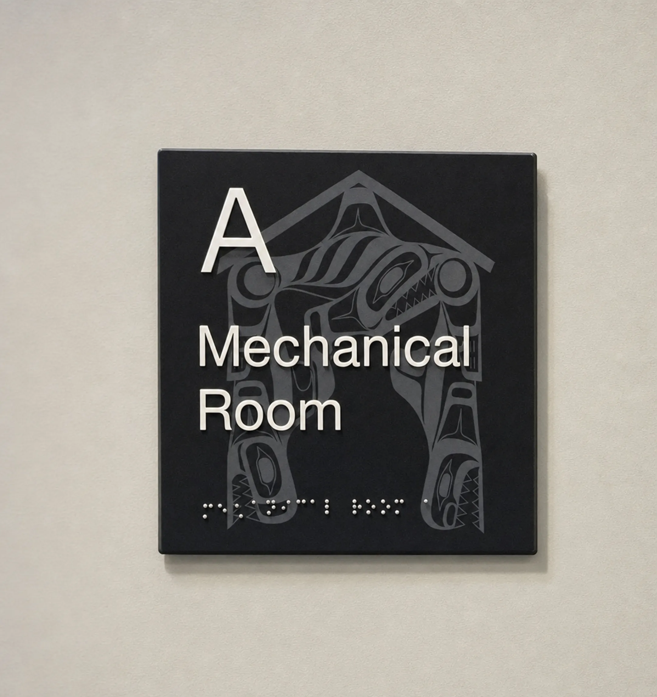 Cast acrylic ADA sign with tactile characters and Braille lettering
