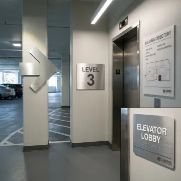 Wayfinding signs inside a parking garage