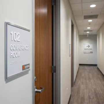 ADA office signs in a commercial hallway